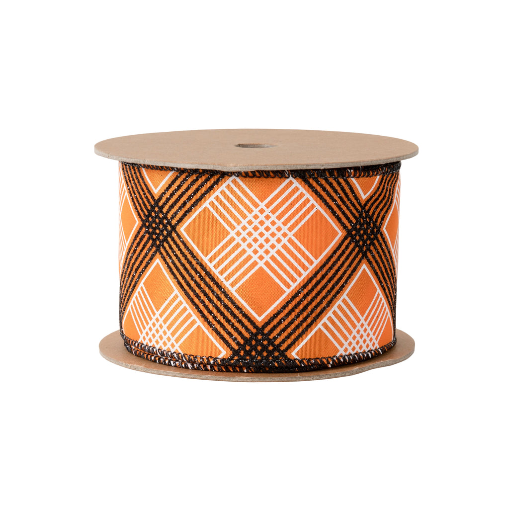 A spool of patterned ribbon with an orange, white, and black diamond plaid design, mounted on a brown cardboard core, shown against a plain white background.