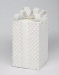 White square Christmas gift box ornament covered in iridescent sequins and finished with a dimensional white ribbon bow