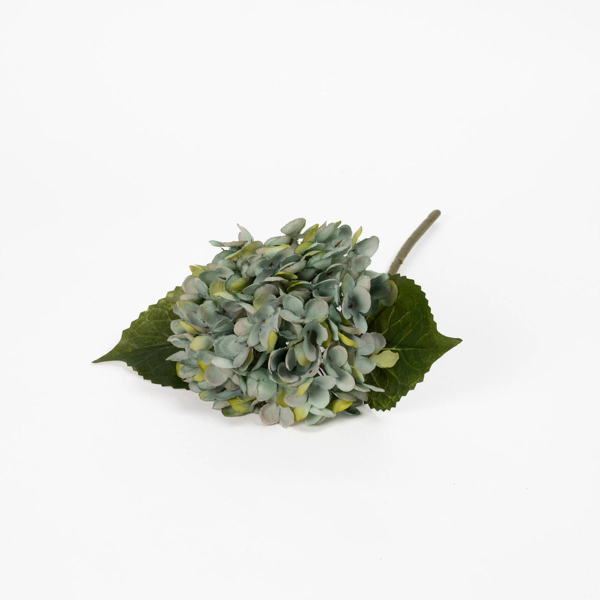 Blue artificial hydrangea bloom showing antiqued blue-green petals and layered texture