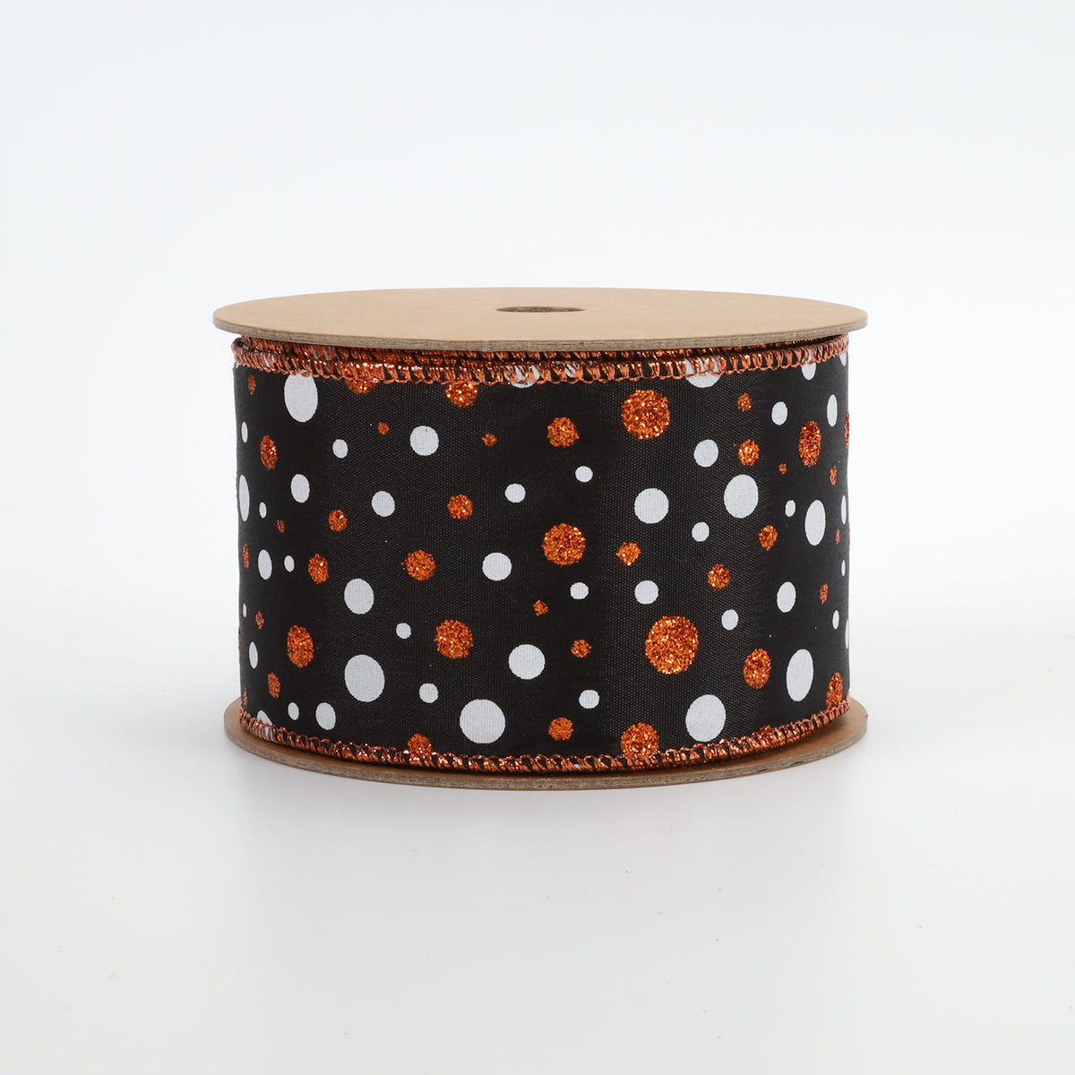 A spool of black ribbon decorated with white and orange glitter polka dots, featuring a matching orange glitter trim on the edges, set against a plain white background.